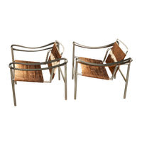 Pair Bauhaus Basculant LC1 Sling Armchairs Le Corbusier Cow Hide Cassina 1960s