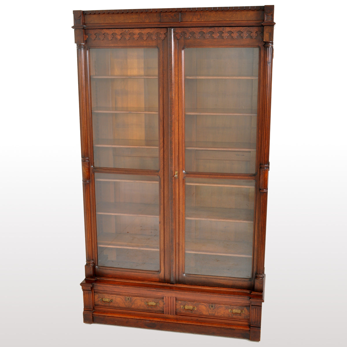 Antique American Renaissance Revival Eastlake Carved Walnut Tall Bookcase, circa 1875
