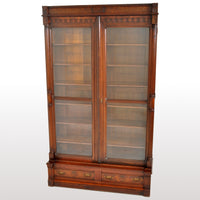 Antique American Renaissance Revival Eastlake Carved Walnut Tall Bookcase, circa 1875