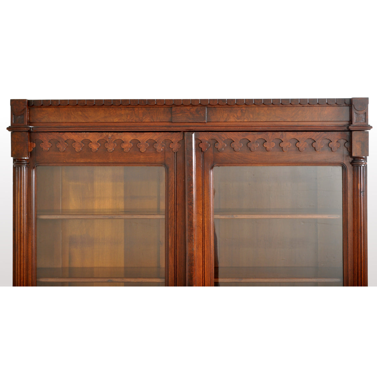 Antique American Renaissance Revival Eastlake Carved Walnut Tall Bookcase, circa 1875