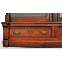 Antique American Renaissance Revival Eastlake Carved Walnut Tall Bookcase, circa 1875
