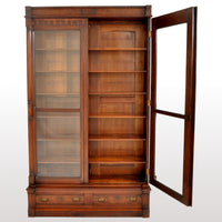 Antique American Renaissance Revival Eastlake Carved Walnut Tall Bookcase, circa 1875