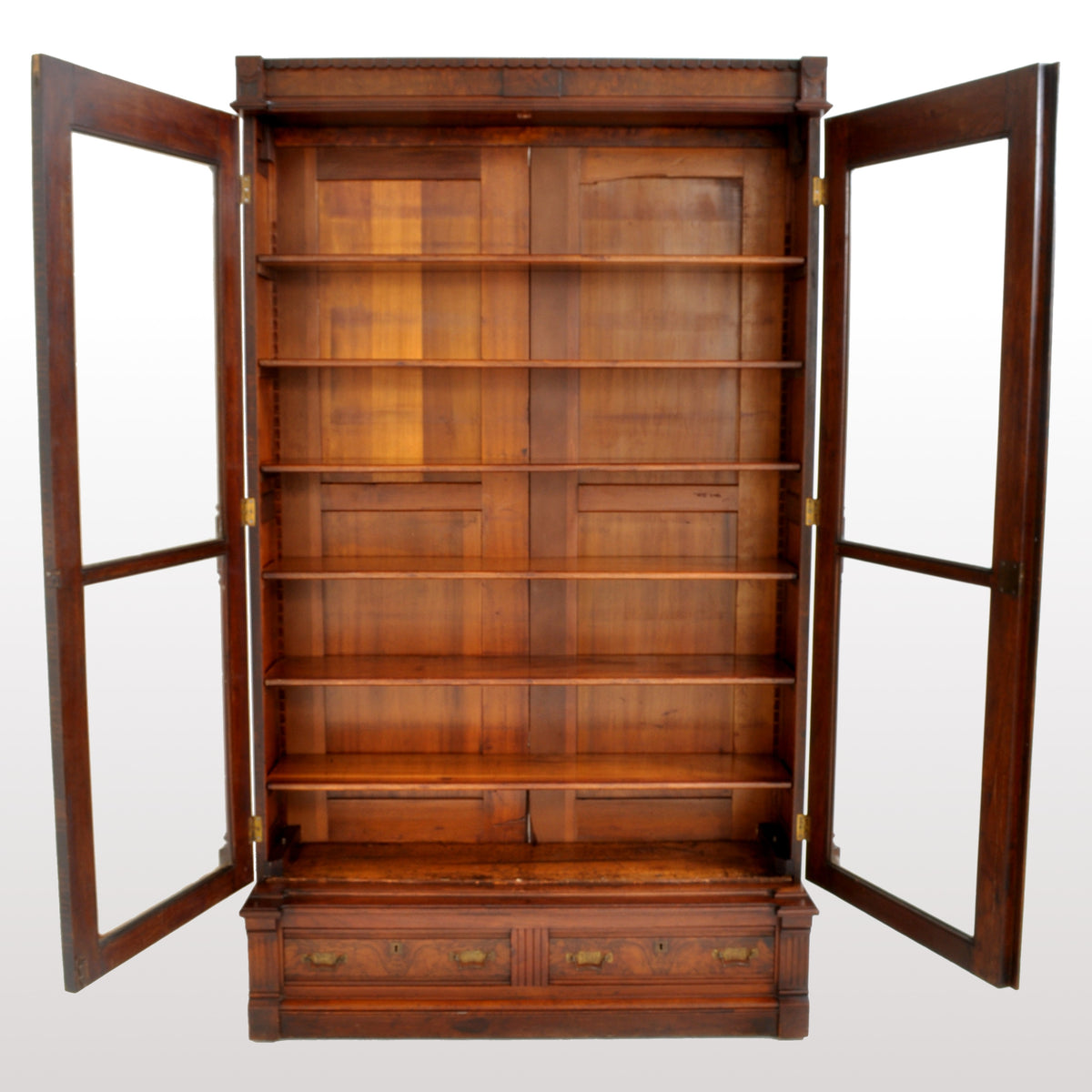 Antique American Renaissance Revival Eastlake Carved Walnut Tall Bookcase, circa 1875