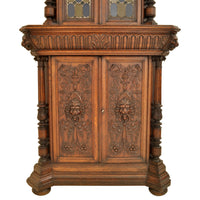 Pair of Antique French Renaissance Revival Carved Oak Stained Glass Corner Cabinets, circa 1880