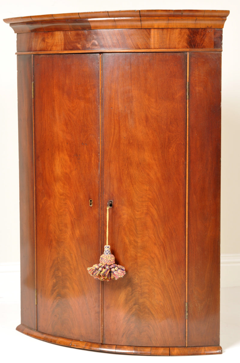 Antique English Georgian Flame Mahogany Bow-Fronted Corner Cabinet, circa 1780