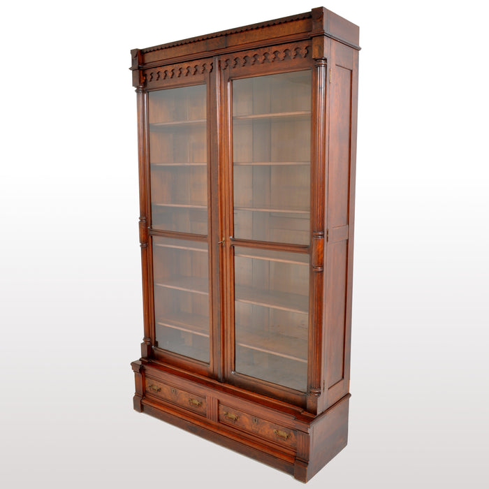 Antique American Renaissance Revival Eastlake Carved Walnut Tall Bookcase, circa 1875