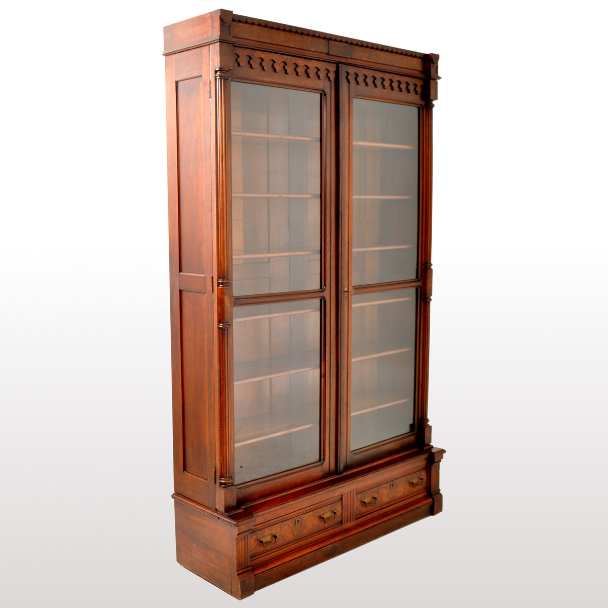 Antique American Renaissance Revival Eastlake Carved Walnut Tall Bookcase, circa 1875
