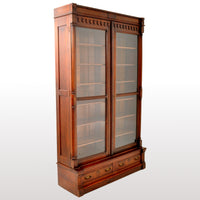 Antique American Renaissance Revival Eastlake Carved Walnut Tall Bookcase, circa 1875